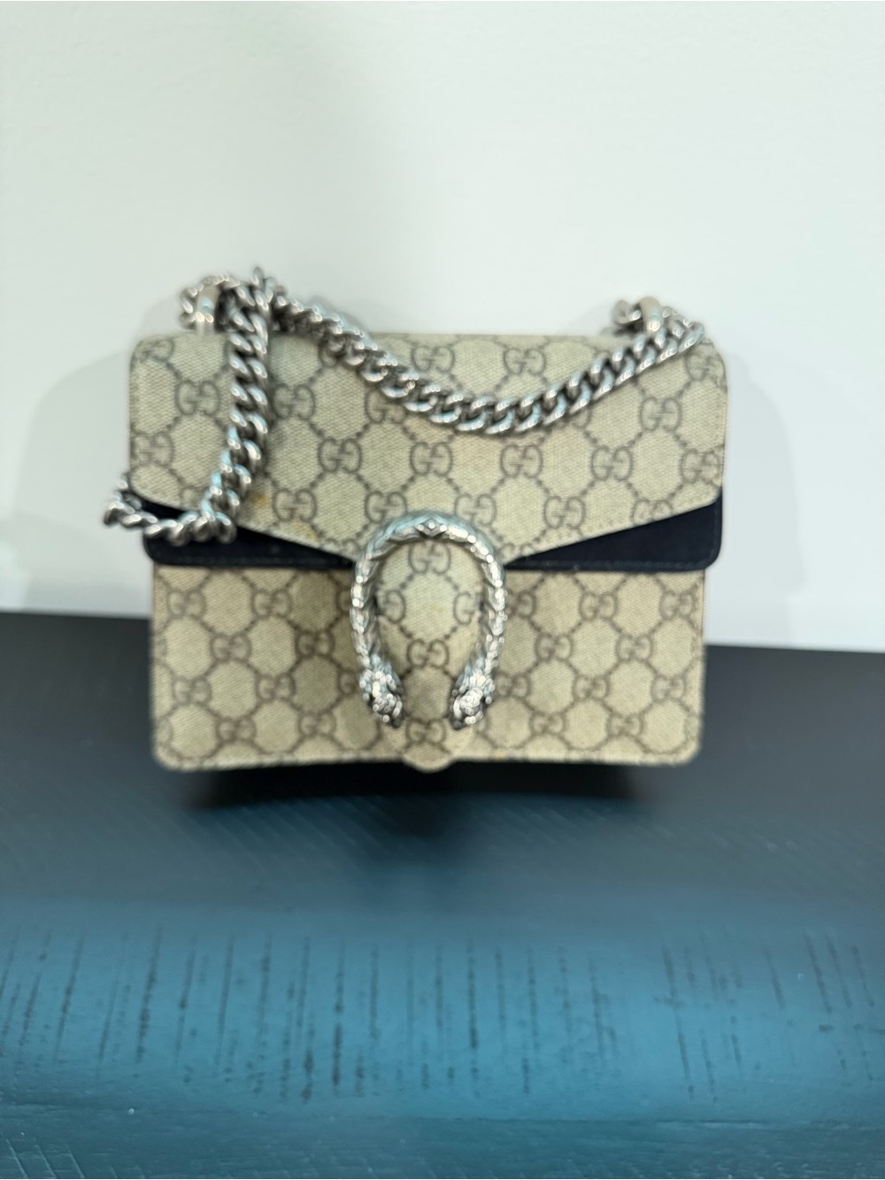 Gucci beige GG Supreme shoulder bag with black trim and silver hardware